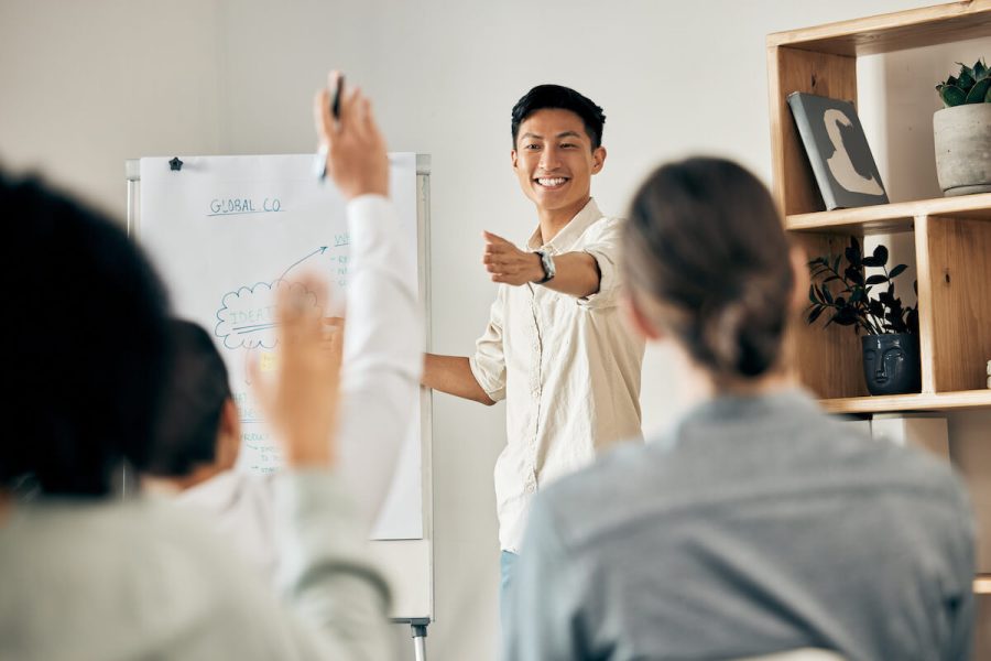 businessman-doing-a-presentation-in-a-meeting-with-2023-11-27-05-30-15-utc.jpg